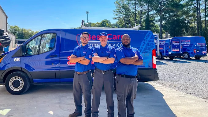 Best Care Home Services technicians standing in front of a service vehicle