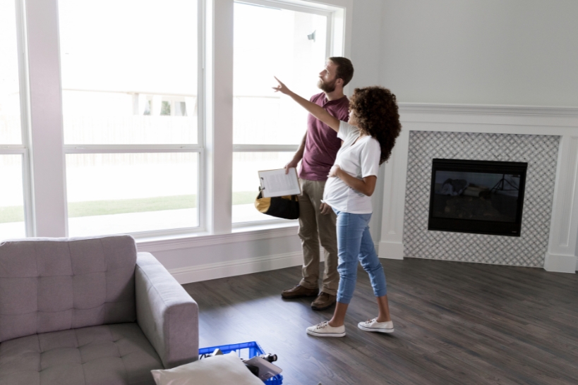 Homeowner comparing furnace and heat pump options for heating a home in the Tennessee Valley.