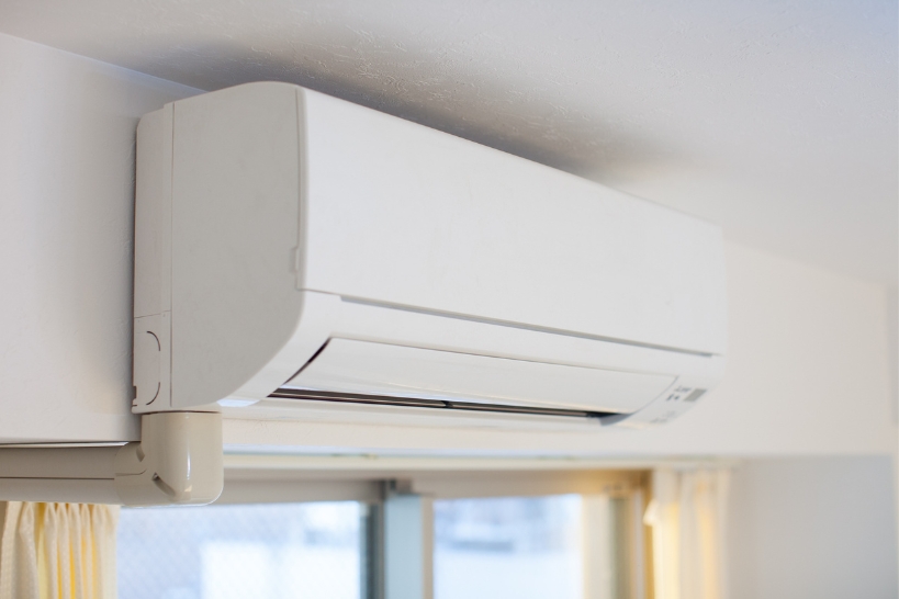Wall-mounted ductless mini-split air conditioner installed inside an Alabama home.