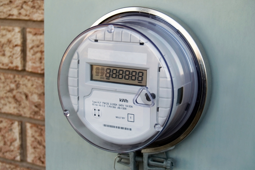 Residential electric meter representing heat pump vs. furnace operating costs in North Alabama.