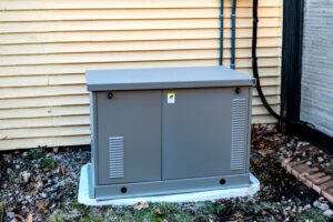 Whole-house standby generator installed outside a residential home in Alabama.